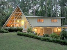 a large house in the woods at night