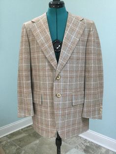 "Men's Plaid Sport Coat ~ Made by Scottsdale ,Jacksonville ,Fl Colors of brown,cream,rust orange,yellow,and blue Partly inlined interior Wool blend Large wide lapels at 4 1/2\" 2 Button front closure 3 Small buttons at cuffs Large 3\" flaps over front pockets 2 Interior chest pockets 11 1/2\" Kick pleat at back Well made and in Excellent Vintage Condition    Size 42 Shoulders -17\" Sleeves -23 1/2\" Chest - 42 Waist buttoned - 39 1/2\" Length -29\" Great Jacket No damages No Odor !" Brown Flat Front Suit For Fall, Brown Flat Front Suits For Fall, Retro Notch Lapel Suits For Fall, Retro Notch Lapel Fall Suits, Fall Retro Suits With Notch Lapel, Vintage Brown Tweed Jacket With Suit Collar, Vintage Outerwear With Welt Pockets And Flat Front, Vintage Single Breasted Tweed Jacket With Long Sleeves, Retro Tailored Suit For Fall