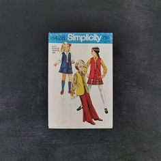 This is a vintage Simplicity sewing pattern for a girl's tunic vest, dagger collar blouse, a-line mini skirt, and bell-bottom trousers, circa 1969. Tunic Vest, Vest Blouse, Girls Vest, Collared Blouse, Blouse Skirt, A Line Mini Skirt, Simplicity Sewing, Simplicity Sewing Patterns