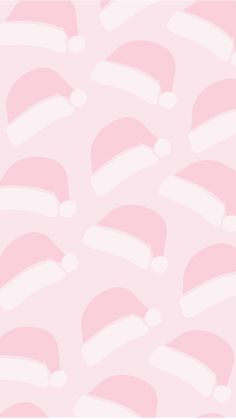 a pink background with santa hats on it