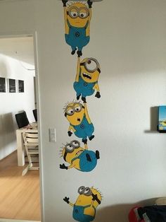 this is an image of a wall decal with minion characters in the background