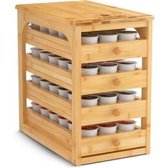 a bamboo spice rack with six trays on it