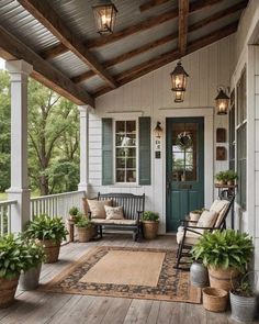 the front porch is decorated with potted plants