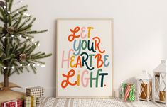 a christmas tree next to a poster with the words get your heart be right