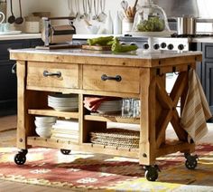 a kitchen island with plates and utensils on it in front of an oven