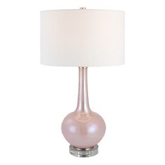 a pink lamp with a white shade on it's base and a light bulb in the shape of a ball