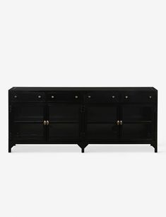 the sideboard is black and has brass hardware on it's doors, as well as two drawers