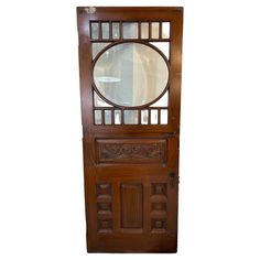 a wooden door with a mirror on the front and side panels inlayed to it