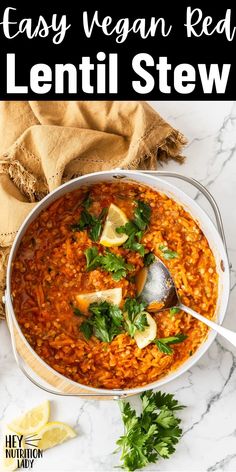 easy vegan red lentil stew in a white bowl with a spoon and parsley on the side