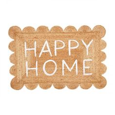 the words happy home written in white paint on a tan mat with scalloped edges