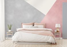 a bedroom with pink, grey and white walls