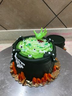 a cake decorated with green frosting and decorations