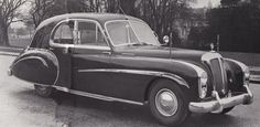 an old black and white photo of a car