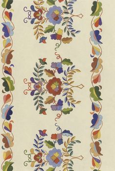 an artisticly designed rug with flowers and leaves on white ground, in various colors