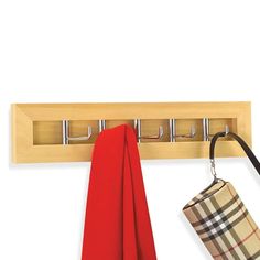 a wooden coat rack with two umbrellas and a red scarf hanging from it's hooks