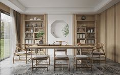 a dining room table with four chairs and a vase on the wall next to it