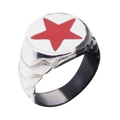 a silver ring with a red star on it