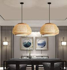 two lamps hanging over a dining room table