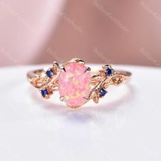 a pink opal and blue sapphire ring