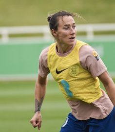 a female soccer player in action on the field