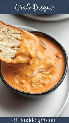 a close up of a bowl of food with bread