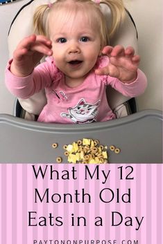 a baby sitting in a high chair with the words what my 12 month old eats in a day