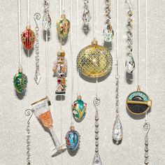 a collection of glass ornaments hanging from strings