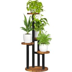 three tiered plant stand with potted plants