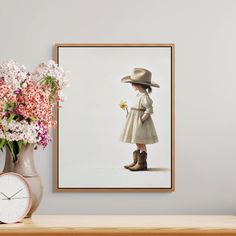 Bring the charm of the wild west into your little one's room with this stunning cowgirl print. Perfect for a cowgirl nursery, this girls nursery print captures the spirit of country life with a sweet girl in a cowboy hat and boots, holding a single daffodil. This printable wall art is a beautiful addition to any western nursery, adding warmth and rustic charm. Whether you're decorating a baby girl nursery or a country nursery, this piece offers the perfect blend of cowgirl decor and timeless elegance. Its soft tones and simple design make it versatile for various rustic nursery decor styles, making it a great choice for creating a serene and cozy space for your little rodeo princess. This cowgirl wall art is a wonderful way to bring personality and charm into your western nursery or countr Single Daffodil, Country Nursery Decor, Cowgirl Room Decor, Country Nursery, Rodeo Baby, Cowgirl Room, Western Nursery, Cowboy Hut, Cowgirl Decor