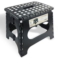 a black step stool with white dots on it