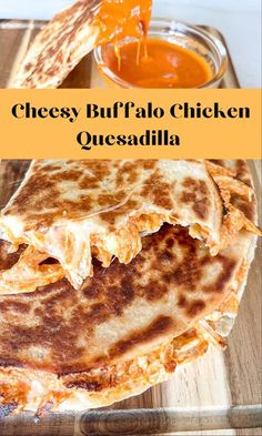 cheesy buffalo chicken quesadilla on a cutting board with sauce in the background