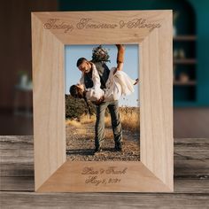 a wooden frame with an image of a couple holding each other