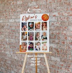 a sign on a wooden easel in front of a brick wall with pictures of babies