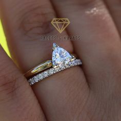 a woman's hand with a yellow diamond ring on it and the words facets & karats