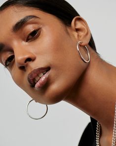 Classic Large Hoop Earrings | Sterling Silver Silver Plated. Introducing Our Lightest Ever Hoops — an Elevated Collection of Everyday Essentials that are Anything but Basic. These Simple Oversized Hoops Have Been Handcrafted to Become Your New Core Staples. Plus, they Feature a Hidden Hinge for a Seamless Closure. Wear Solo or Style with Studs and Mini Hoops for an Instant Statement Ear Stack. Also Available in Small, Medium and Oversized. Metal: Rhodium Plated on Recycled Sterling Silver Hoop D