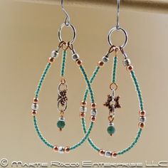 two pairs of earrings with beads hanging from them