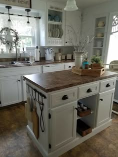 a kitchen island with utensils on it