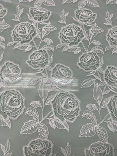 white lace with roses on grey background