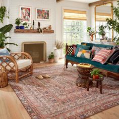 a living room filled with furniture and plants