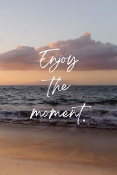 an image of the ocean and sky with words that say enjoy the moment on it