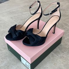 Nwt Kate Spade Bridal Bow Heels. Black Satin, Size 9.5. Buckle Closure At Ankle Strap. Topped With A Feminine Twisted Bow. 100% Kid Leather Lining. 4” Platform Heel. 1/2” Platform. Brand New In Box With Dust Bag. Pretty Heels Black, Black Heels & Wedges, Bow Heels Black, Gold Pumps Heels, Black Bow Heels, Kate Spade Clothes, Black Heels With Bow, Open Toe Sandals Heels, Bridal Bow