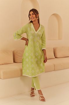 PRODUCT DETAIL: This comfortable and breezy suit set is crafted from soft cotton fabric and comes in a lovely shade of lime green, enhanced with delicate lace detailing. The elegant embroidery and cutwork add to the charm of this must-have piece, which includes straight pants for a sophisticated look. The dupatta features a block-printed abstract design to complete the ensemble. SPECIFICATIONS: Color Lime Green Fabric 100% Cotton Product Code Gul23 Suit Designs Indian Style Latest, Suit Designs Indian Style, Suits For Women Indian, Printed Kurti Designs, Cotton Suit Designs, Kurti Pant Set, Kurti Style, Lace Suit