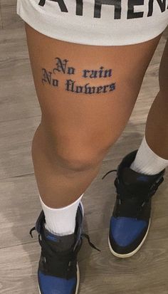 the legs and ankles of a person with tattoos that say no rain, no flowers