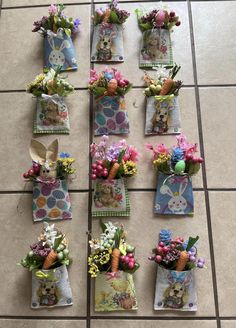 there are many small baskets with flowers and bunnies on the floor next to each other