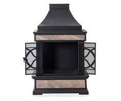 an old fashioned fireplace with glass inserts on the front and side panels around it