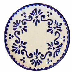 a blue and white plate with an ornate design