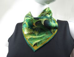 "This little 16\" small scarf is just big enough to add a sophisticated accent to your outfit without bulk. \"Longwood\" is a play on symmetry with green and gold stylized leaves. Digitally printed on fine silk. Fresh colors in art-to-wear on very high quality silk satin tiny scarf. Choose from a traditional hand-rolled hem. 16\" wide square OR the flatter machine-hemmed finish which is slightly larger at 17\" wide square and features a wider border.   IMPORTANT SIZING NOTE: The mannequin's neck Green Silk Scarves For Formal Occasions, Formal Green Silk Scarves, Tiny Scarf, Gold Scarf, Small Scarf, Ann Arbor, Rolled Hem, Mulberry Silk, Arbor