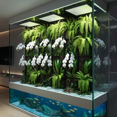 an aquarium filled with plants and fish in front of a flat screen tv mounted on the wall