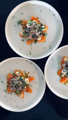 three white plates topped with different types of food