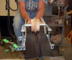 a man working on an assembly line in a shop